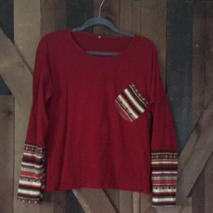 Ladies large top with thumb holes in sleeves. Cute pocket on front.